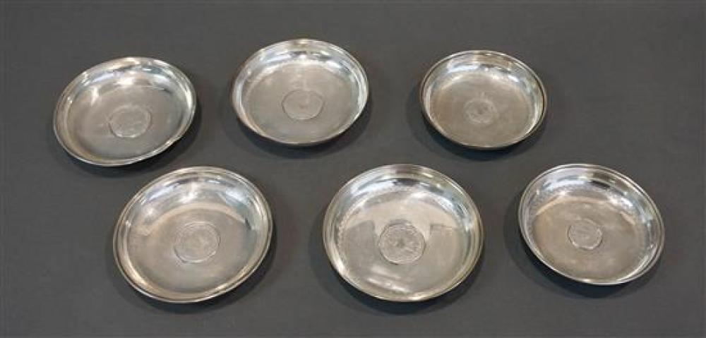 SIX COIN MOUNTED SILVER DISHES, 13.5