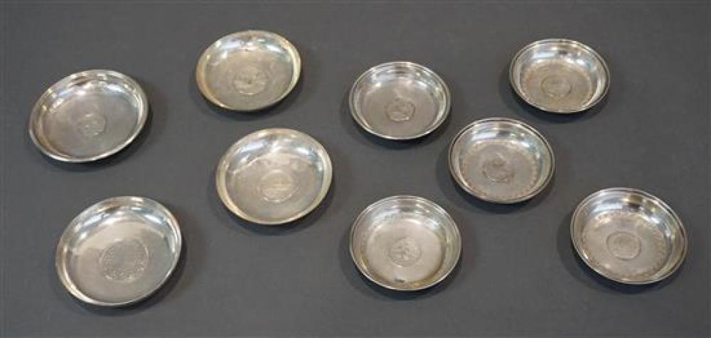 TEN COIN MOUNTED SILVER DISHES,