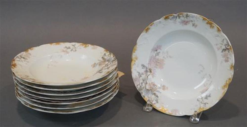 EIGHT LIMOGES FLORAL GILT DECORATED