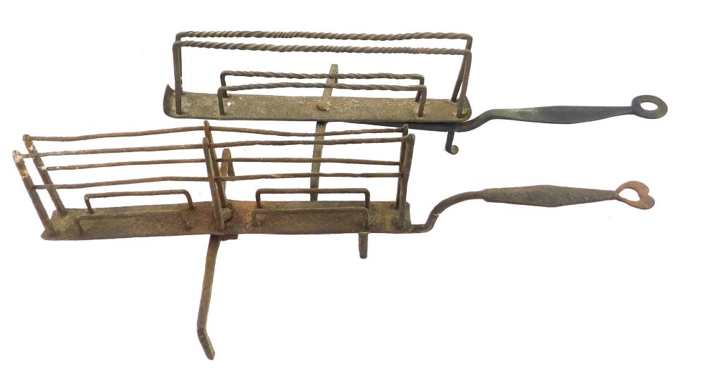 TWO EARLY IRON SWIVEL TOAST RACKS  31e7f4