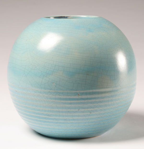 Blue spherical art pottery vase; pine