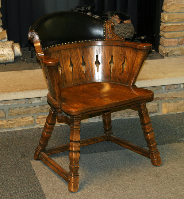 Romweber oak barrel back captains chair;