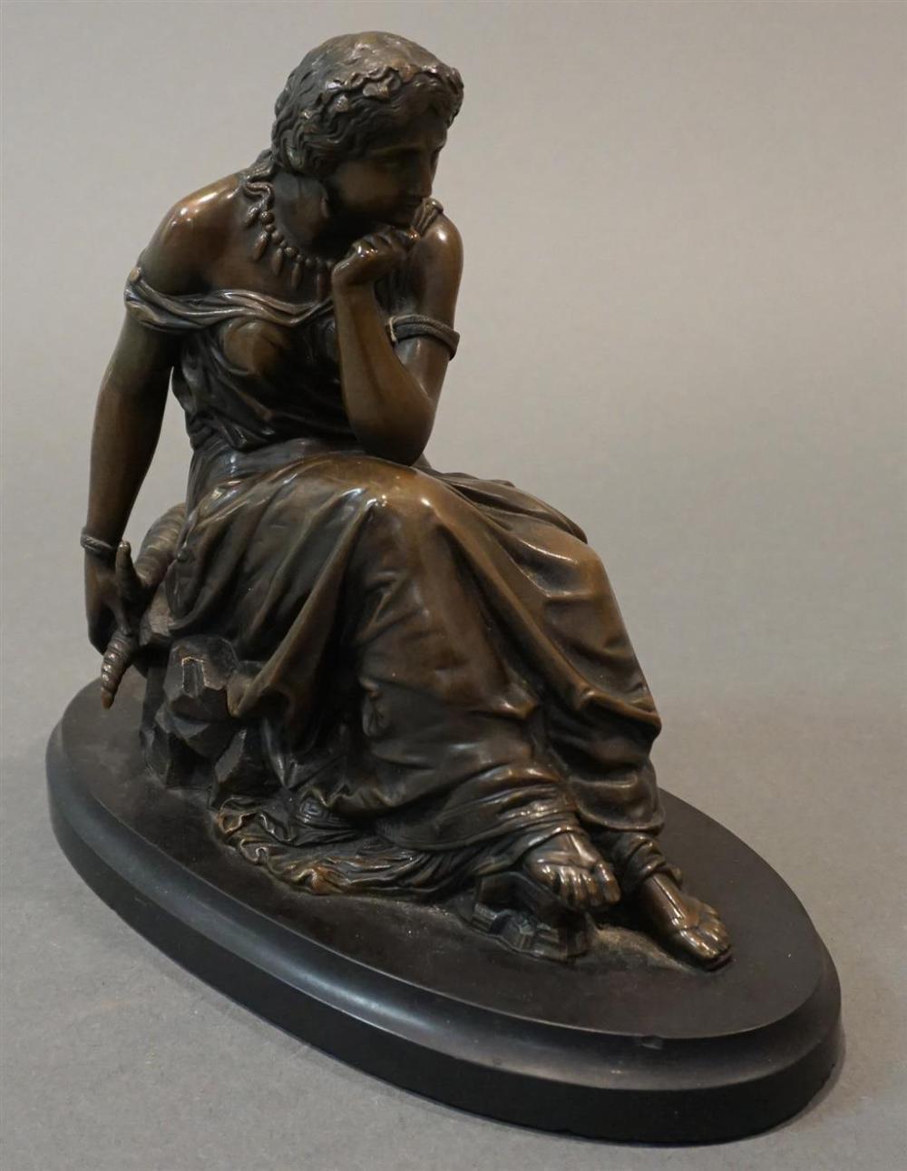 BRONZE FIGURE OF A WOMAN HOLDING