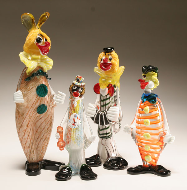 Four Murano art glass clown figures.