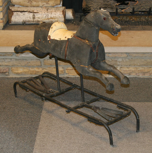 Childs platform rocking horse; running