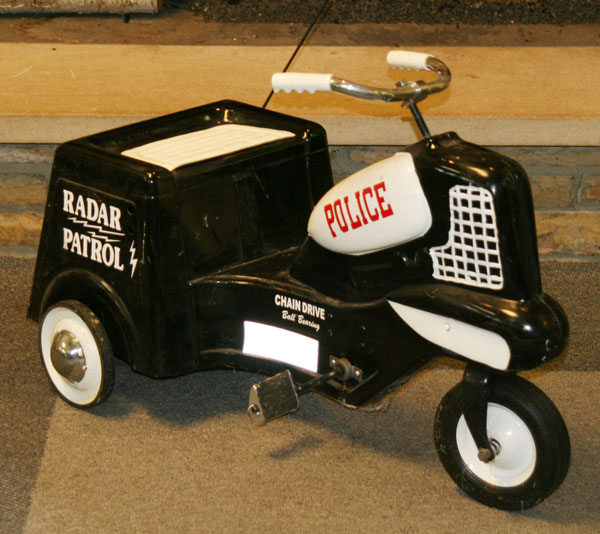 Childs riding pedal car; police motorcycle/tricycle;