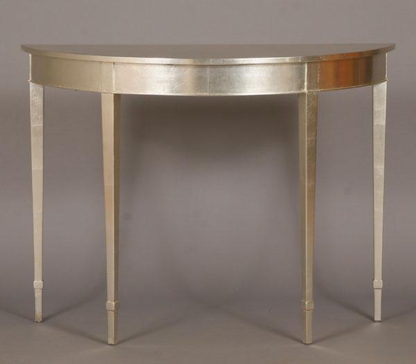 Silver leaf demi-lune entry table.