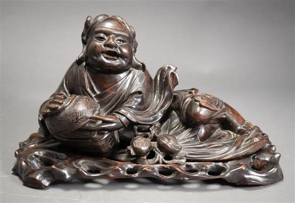 CHINESE CARVED WOOD RECUMBENT FIGURE