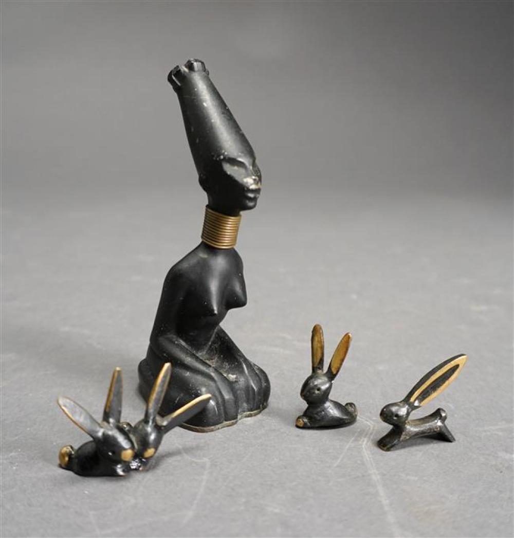 PATINATED METAL FIGURE OF KNEELING WOMAN