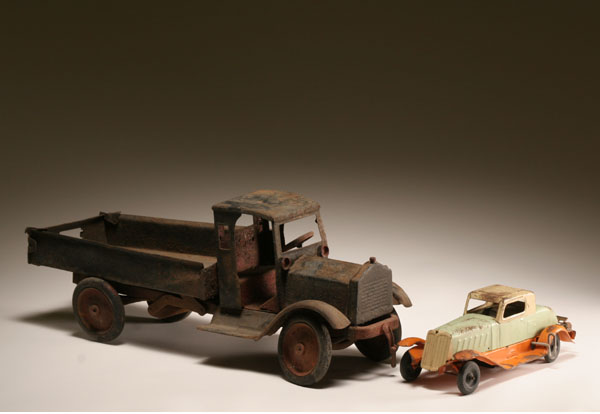 Pressed metal toys, early dump truck