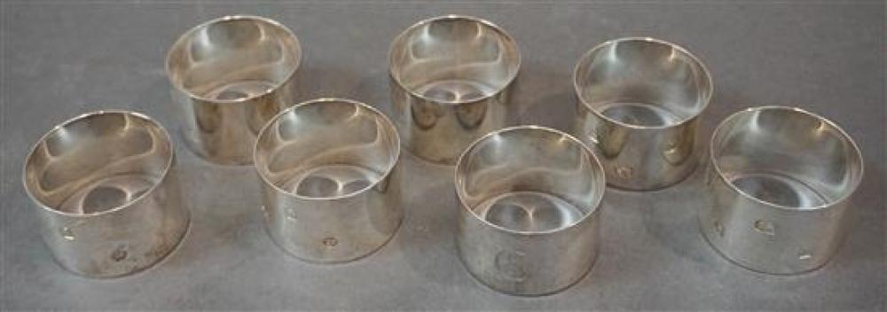 SET WITH SEVEN ENGLISH SILVER NAPKIN