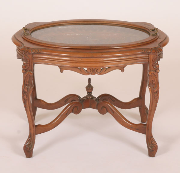 Carved walnut oval table with glass 50245