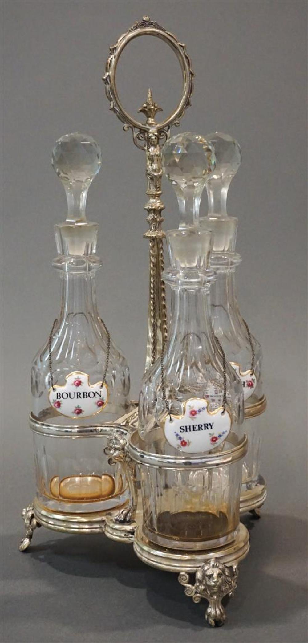 THREE CRYSTAL DECANTERS IN A SILVERPLATE