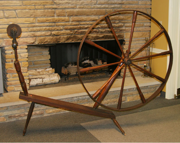Large primitive wooden spinning wheel;