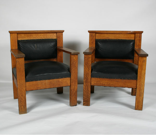 Pair Mission oak arm chairs; upholstered