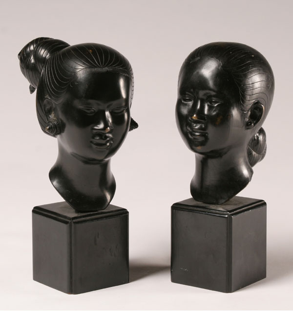 Pair Polynesian female bronze busts;
