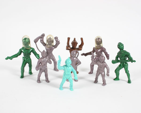 Nine plastic Space Men action figures
