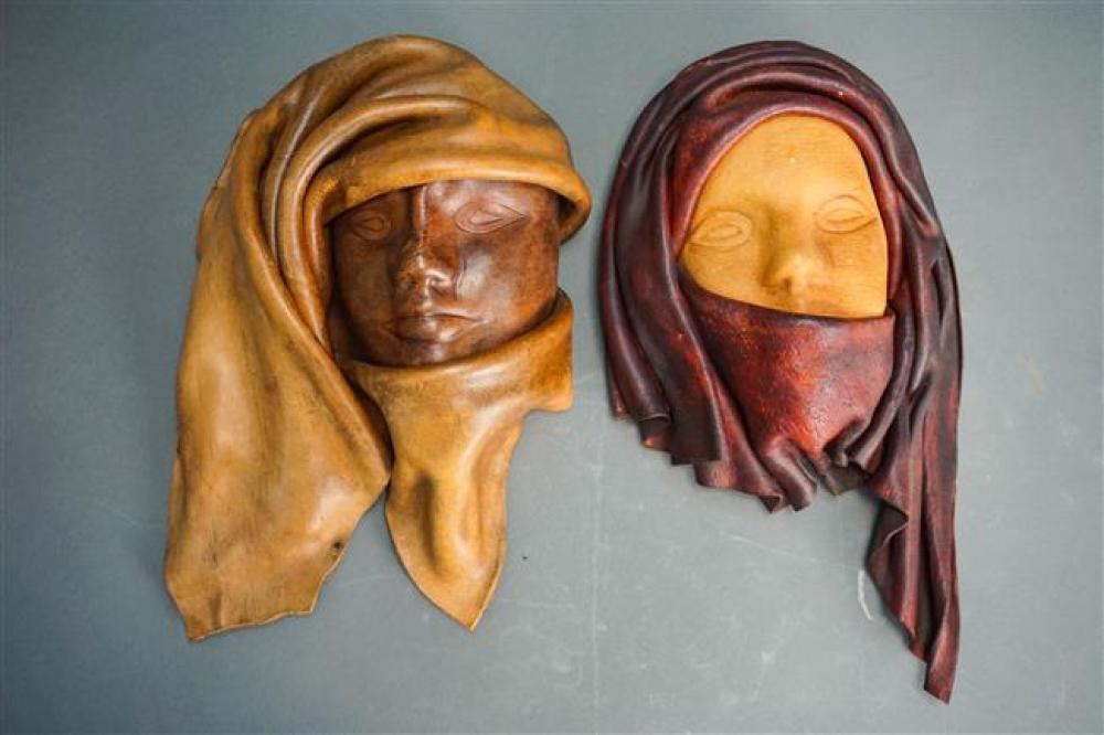 PAIR LEATHER SCULPTURED FACES OF