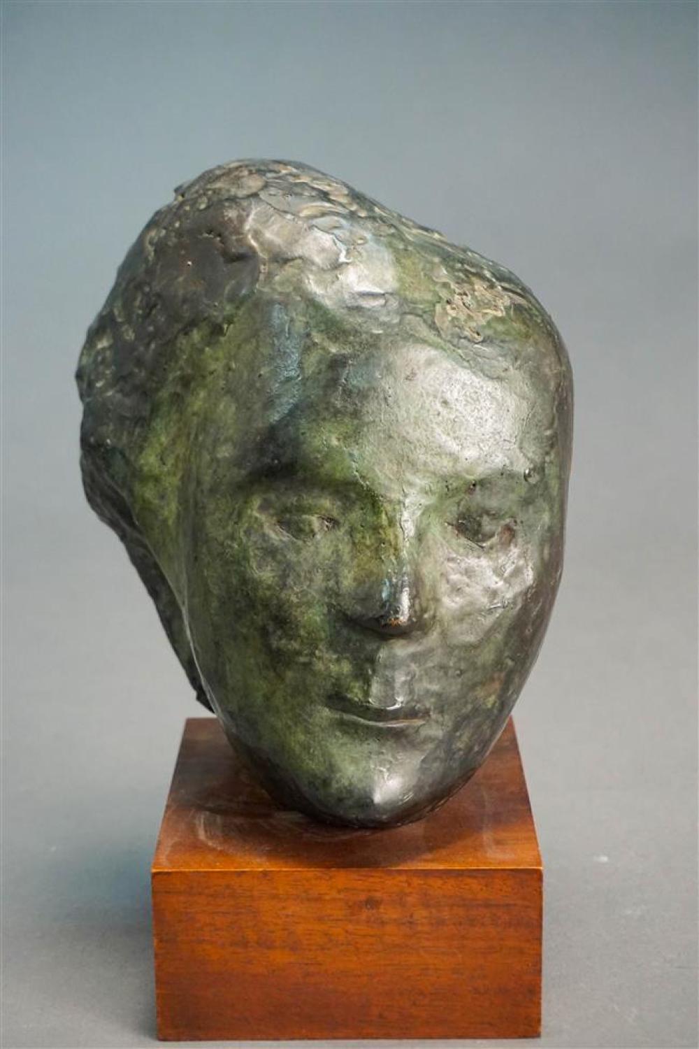 BRONZE BUST OF A WOMAN ON WOOD PLINTH,