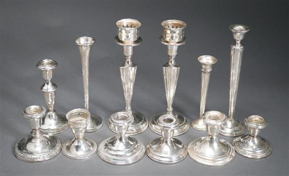 TWELVE WEIGHTED STERLING SILVER CANDLESTICKSTwelve