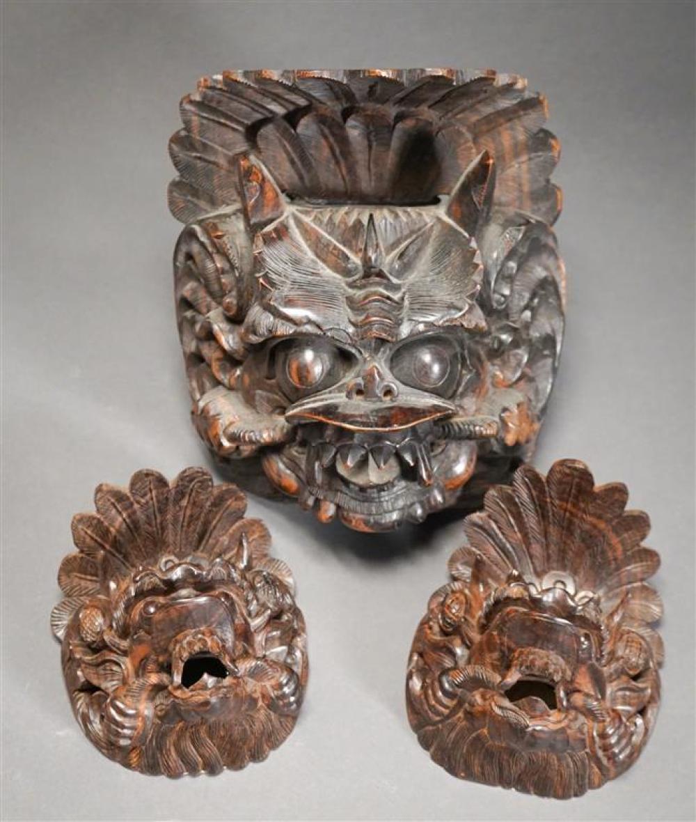 THREE BALINESE CARVED WOOD MASKSThree