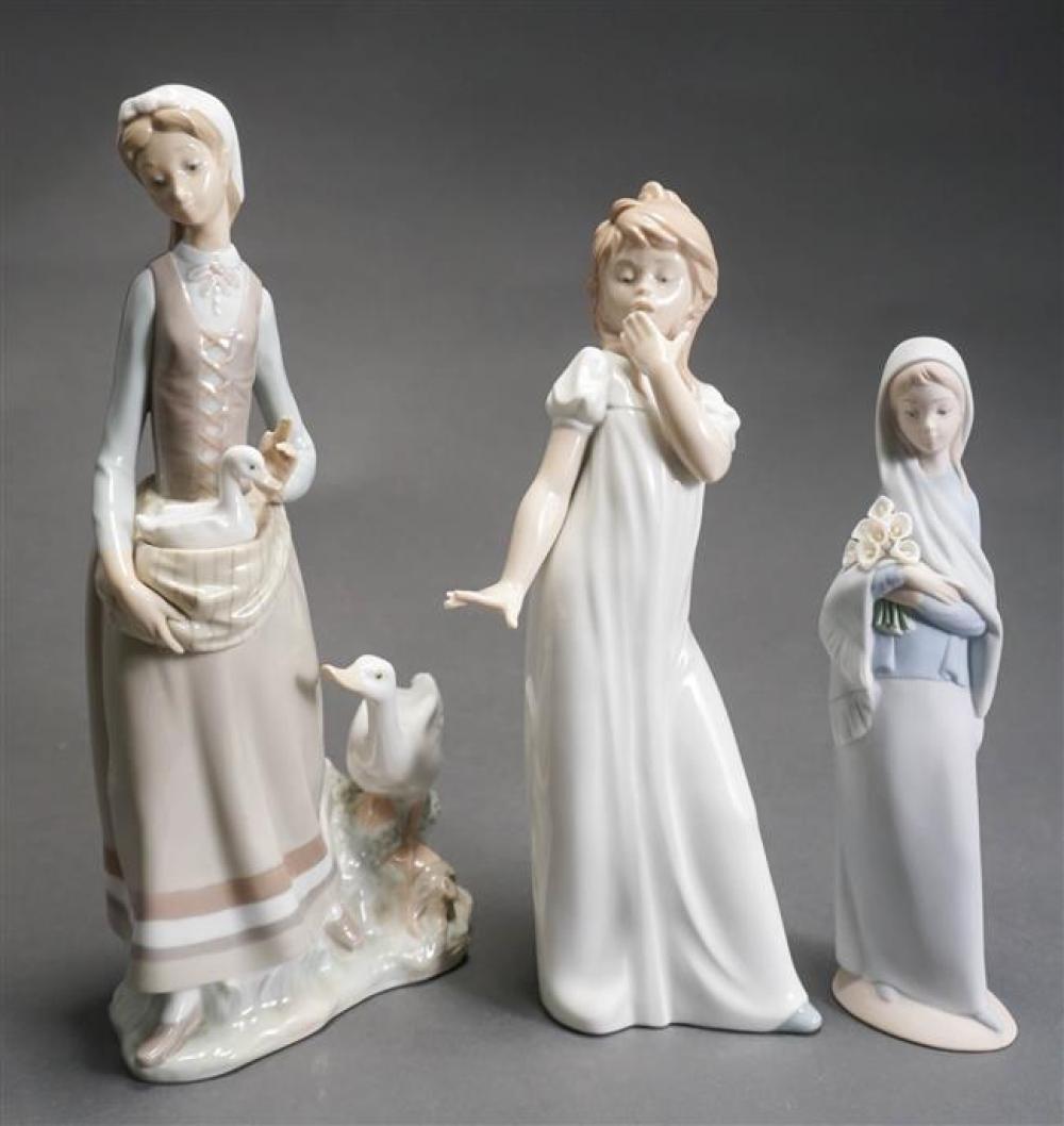 TWO LLADRO AND A NAO PORCELAIN FIGURINESTwo