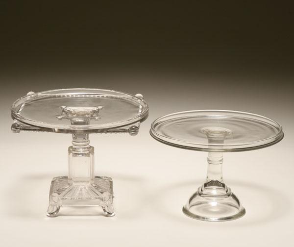 Two pressed glass cake stands: one a