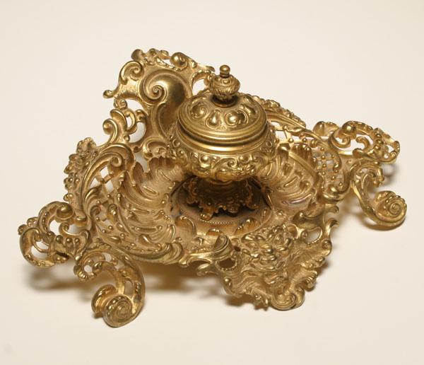 Elaborate brass inkwell with center