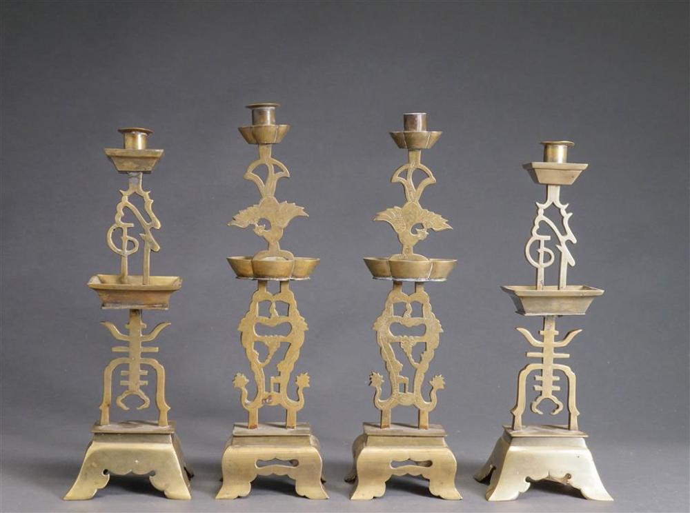 SET OF FOUR CHINESE BRASS CANDLEHOLDERS,