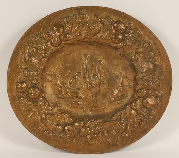 Oval repousse wall plaque; solid