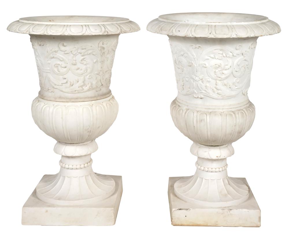 TWO CARVED MARBLE URNSone in two 3276e8