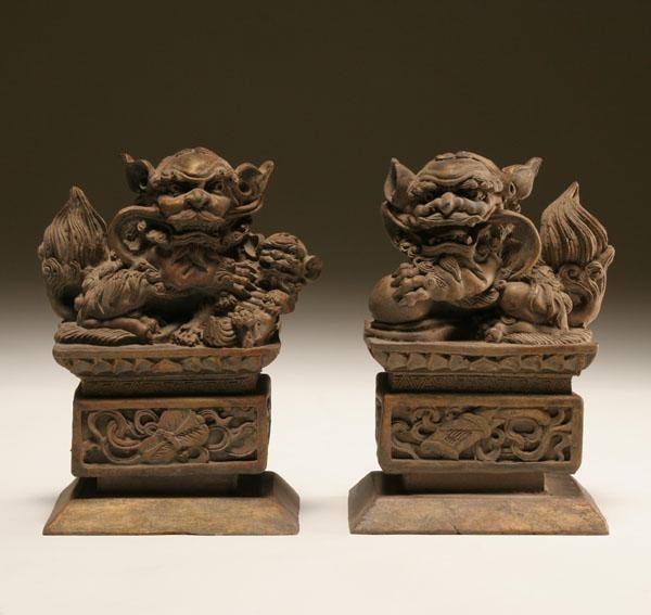 Pair of Chinese hand carved wooden foo