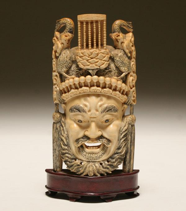 Carved ivory head of a male figure;
