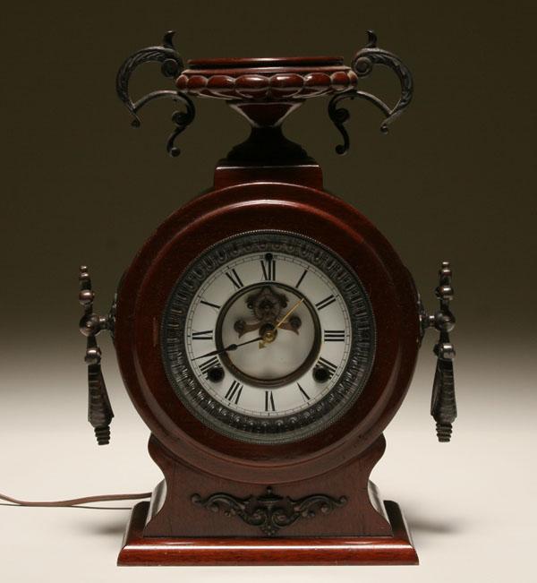 Mahogany mantle clock; metal accents
