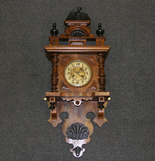 Key wind wall clock; solid walnut and