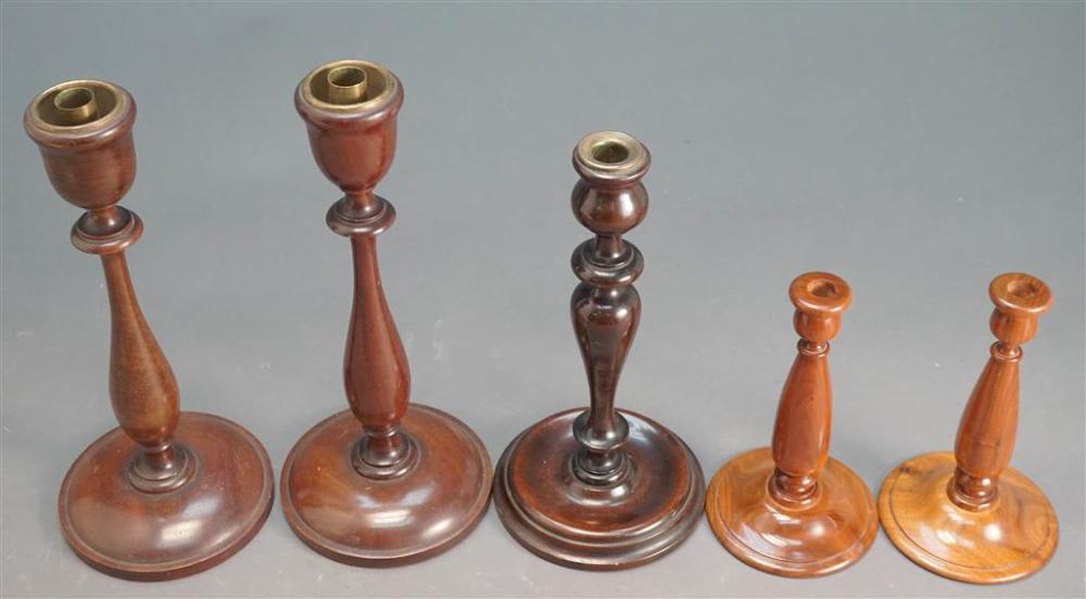 FIVE WOOD TURNED CANDLESTICKS, CONSISTING