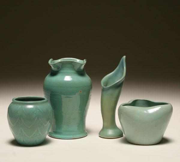 Four art pottery vases with green 50c4a