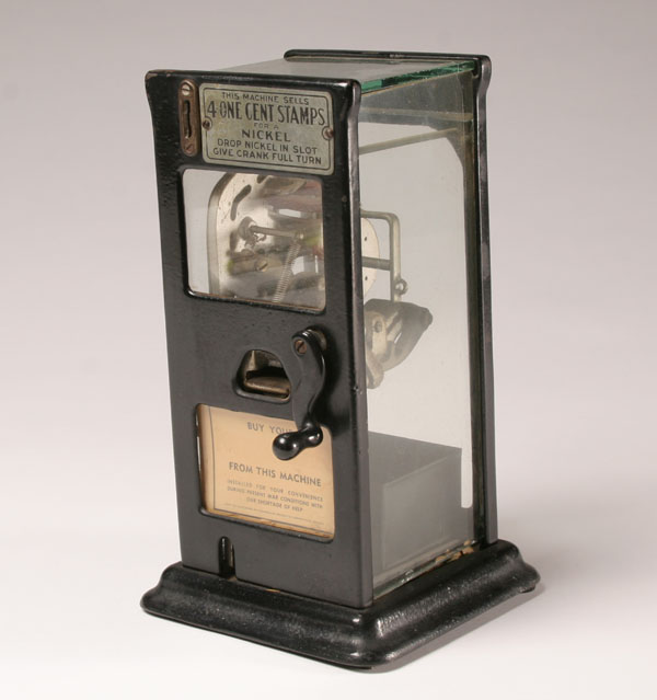 Vintage coin-op stamp machine;