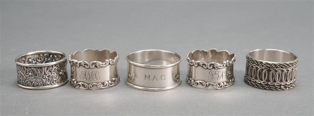 FIVE STERLING SILVER NAPKIN RINGS,