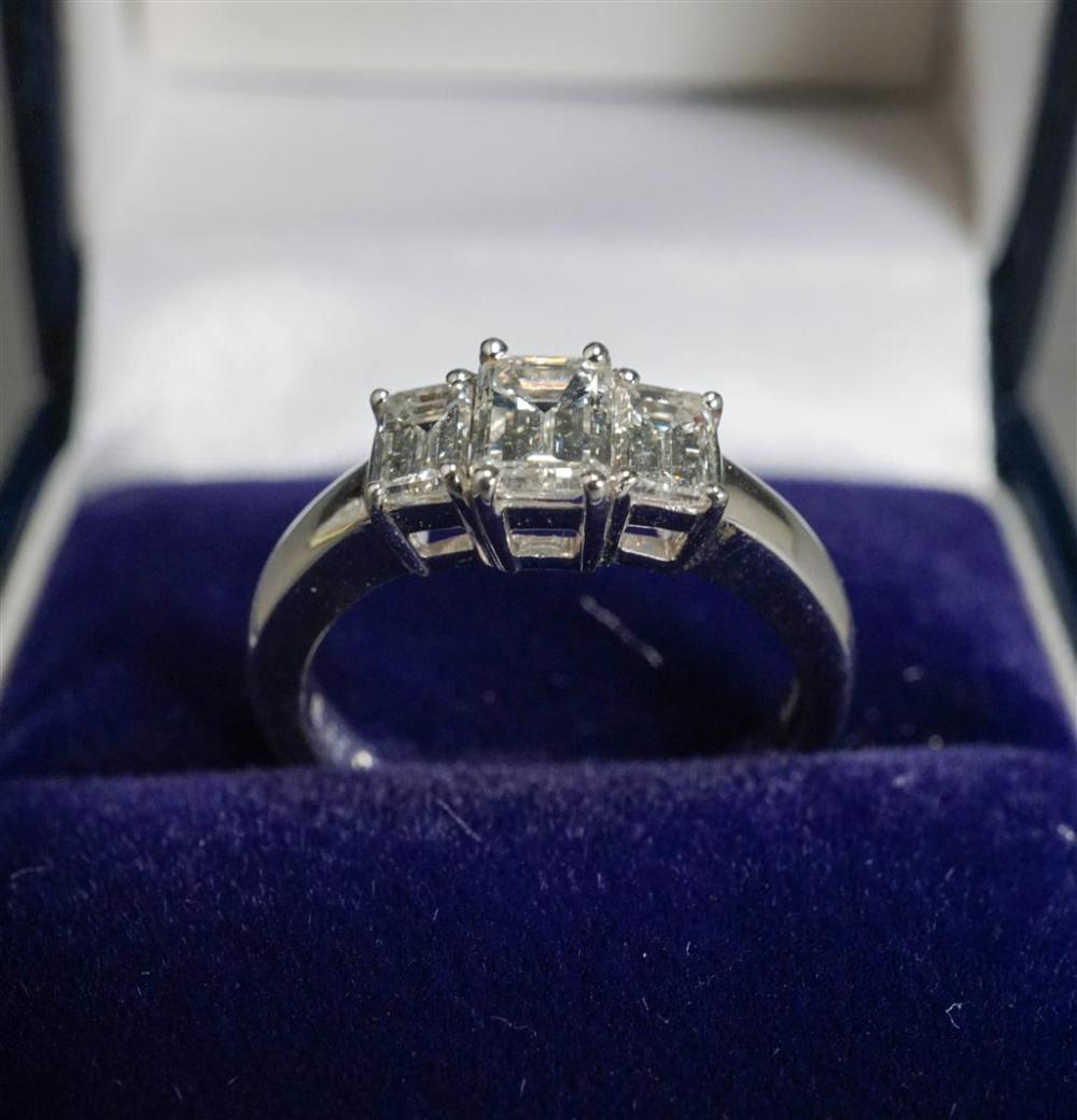 PLATINUM AND THREE-DIAMOND RING,