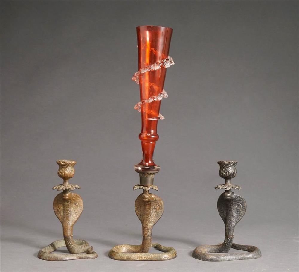 THREE PATINATED METAL SERPENT CANDLEHOLDERS,