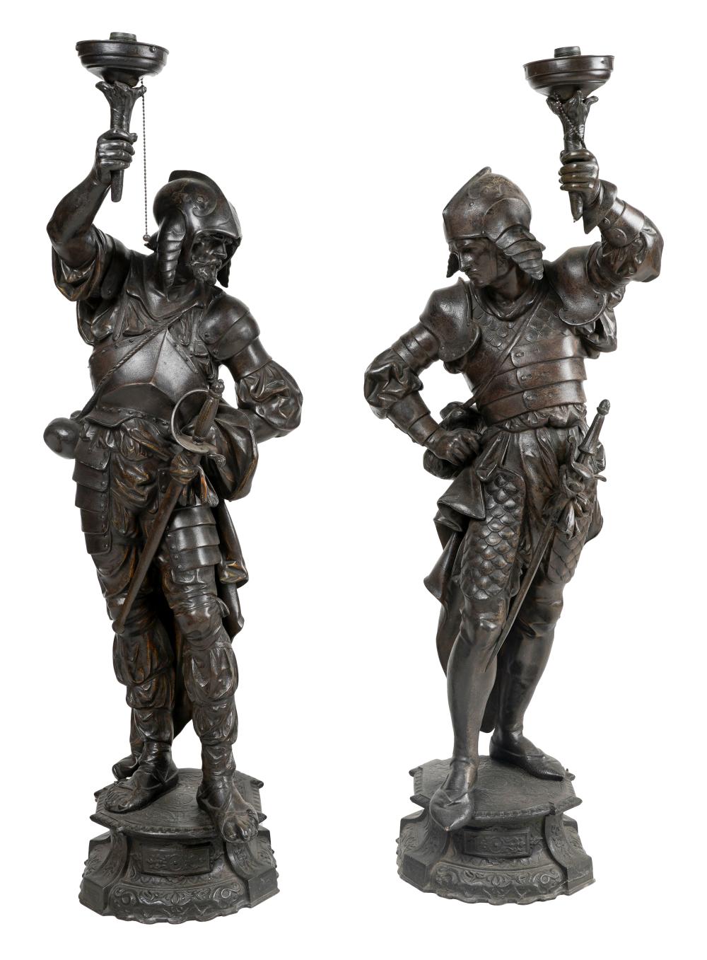 TWO PATINATED METAL FIGURAL TORCHERESmodeled