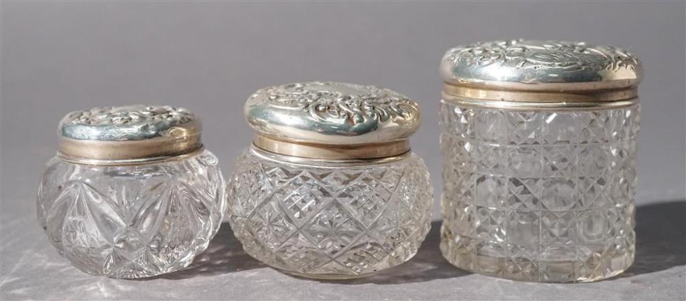 THREE CRYSTAL JARS WITH SILVER LIDSThree