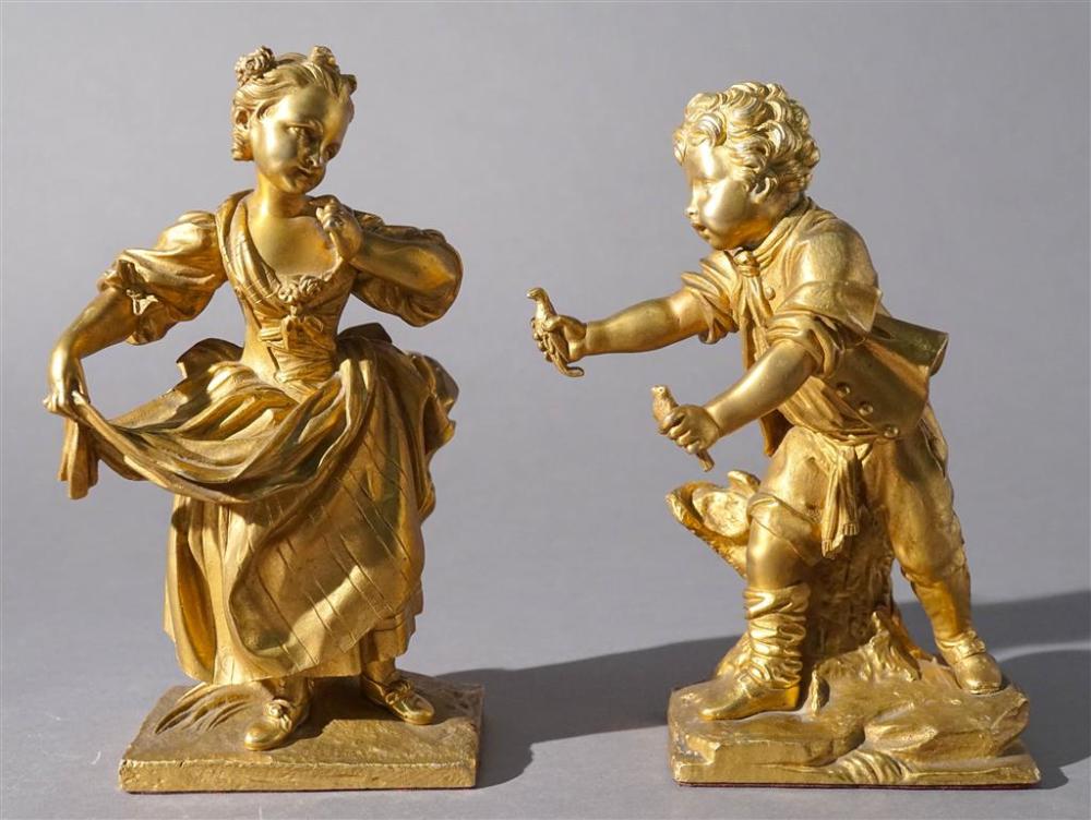 TWO GILT BRONZE FIGURES OF A BOY AND