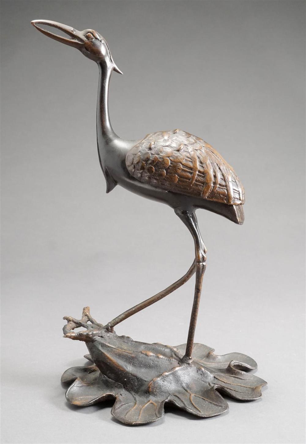 PATINATED METAL FIGURE OF A CRANE