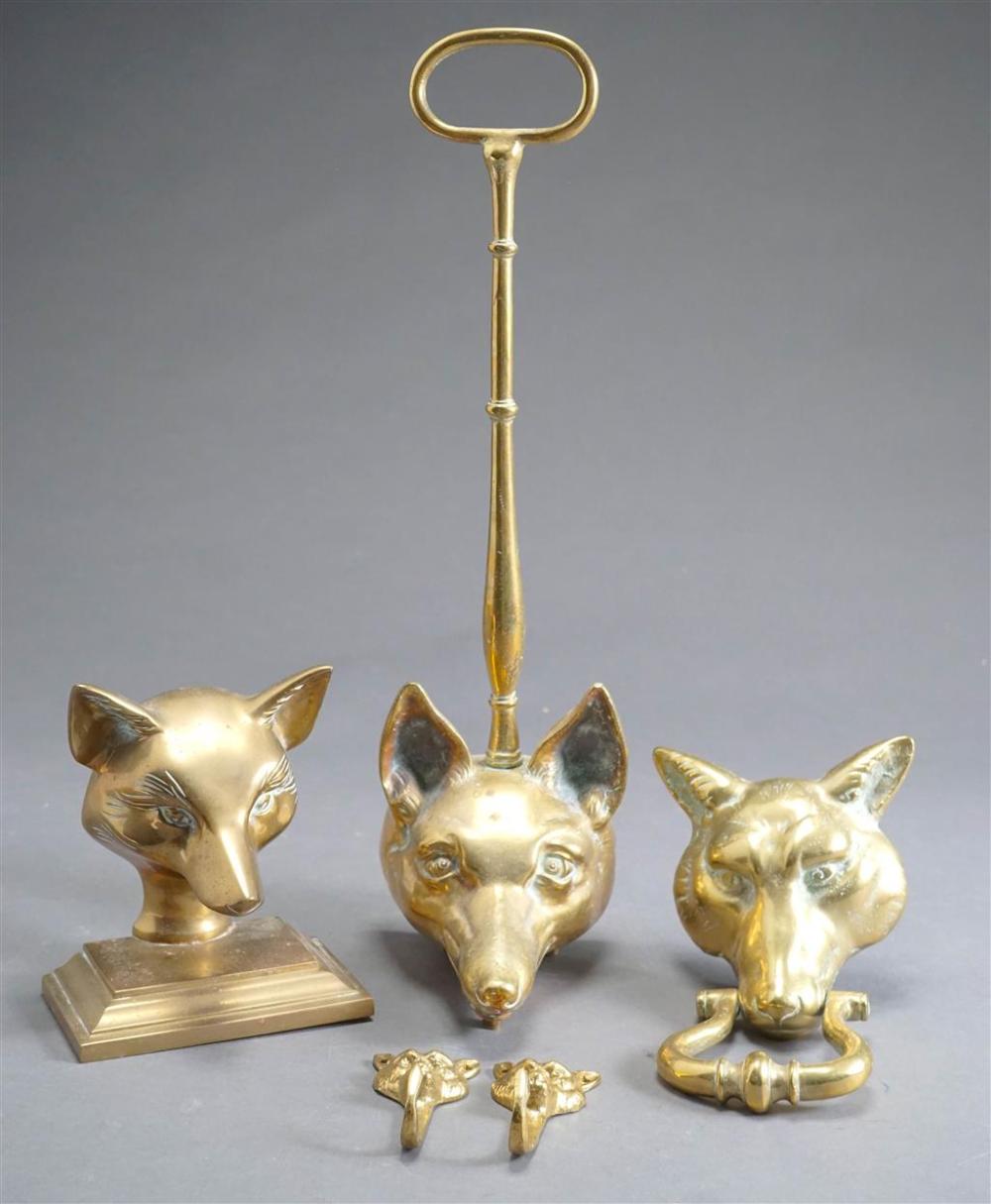 TWO BRASS FOX HEAD DOOR STOPPERS,