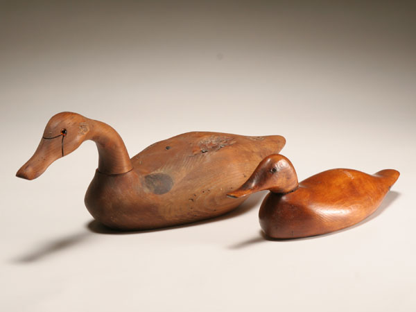 Two hand carved wooden decoys;