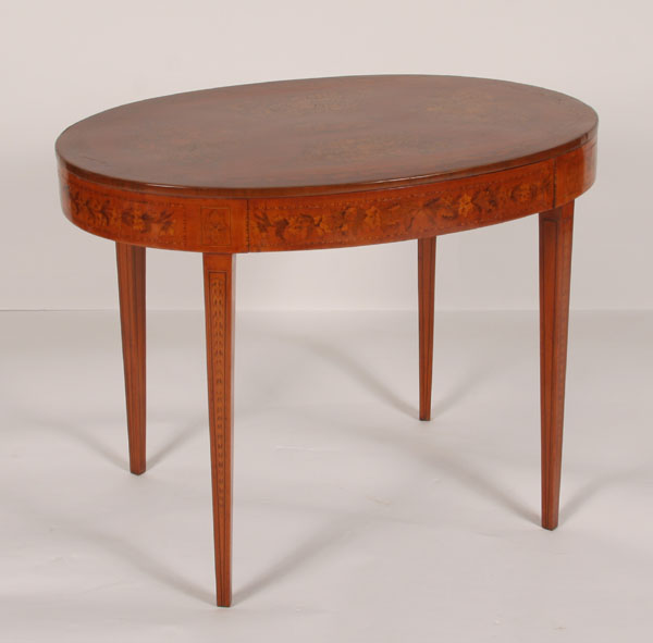 Inlaid marquetry table; oval shape,