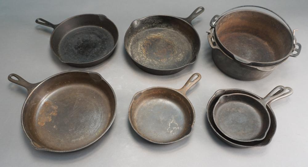 COLLECTION OF CAST IRON POTS AND