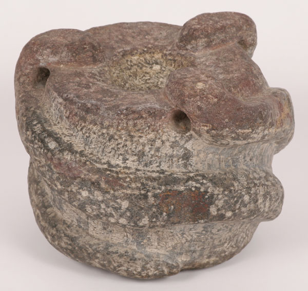 Three serpent effigy stone mortar.